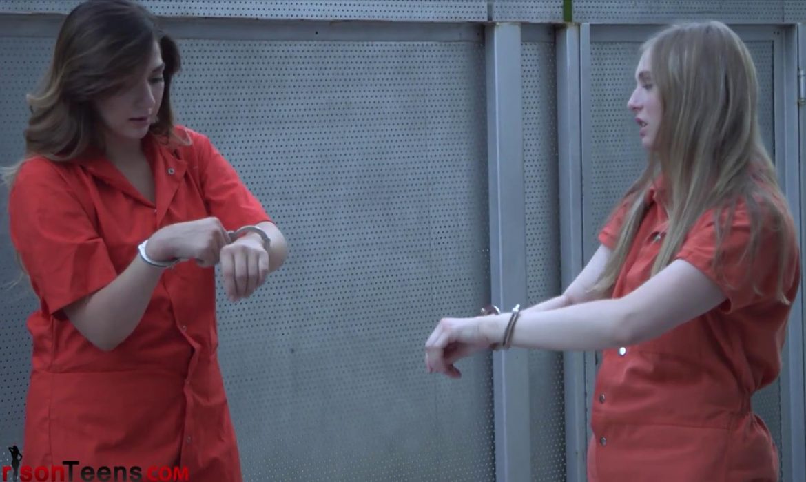 Yard Time - Prison Babes Paige and Corrina are handcuffed and share the same cell