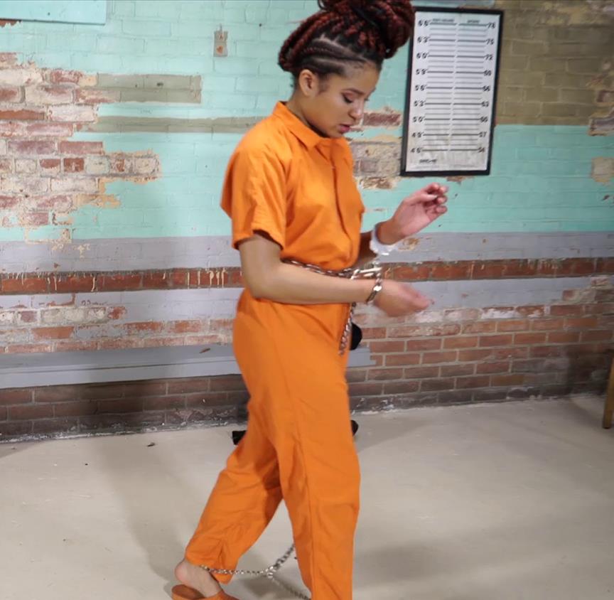 Photo of chained Purple Jade in jail