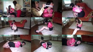 Ptoto of tapegagged Nyxon is roped