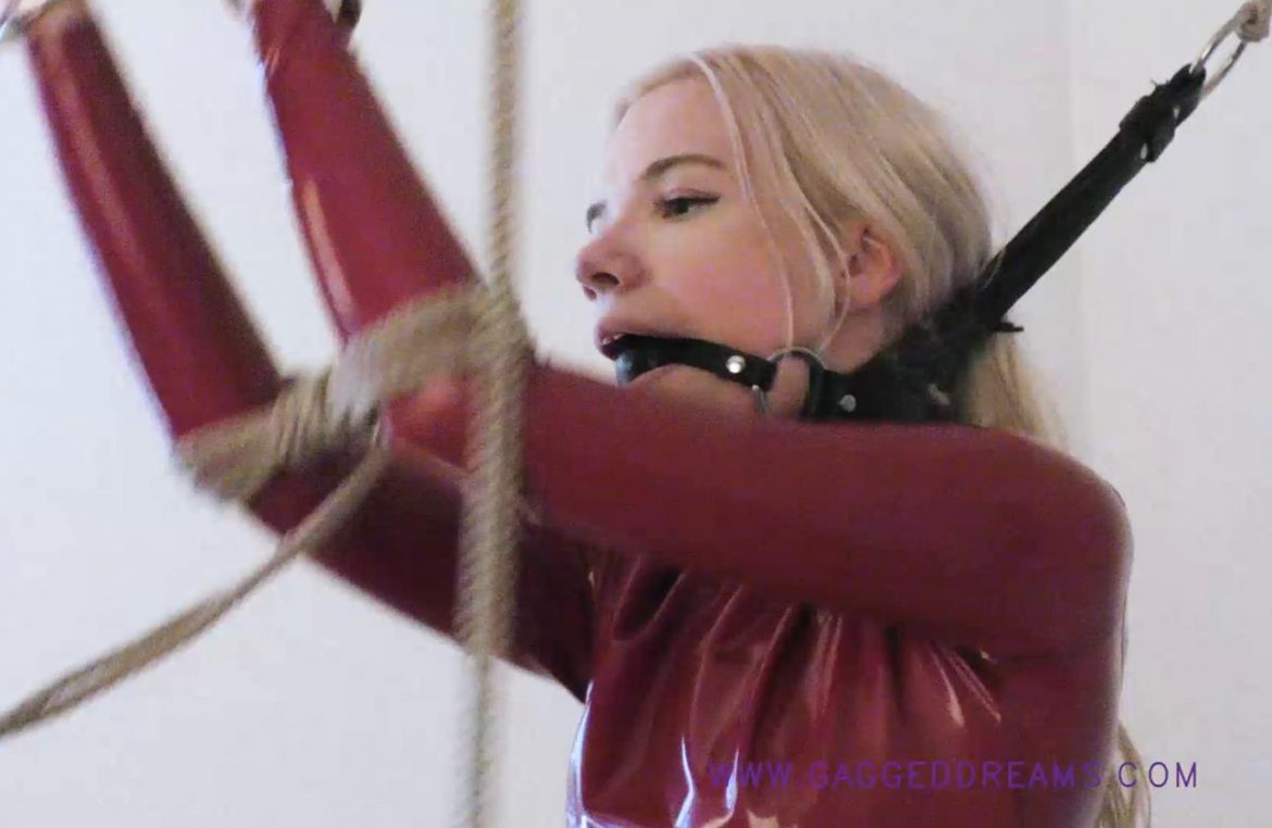 Bound Vanessa in Latex with ropes - Red Desire - Gaggeddreams